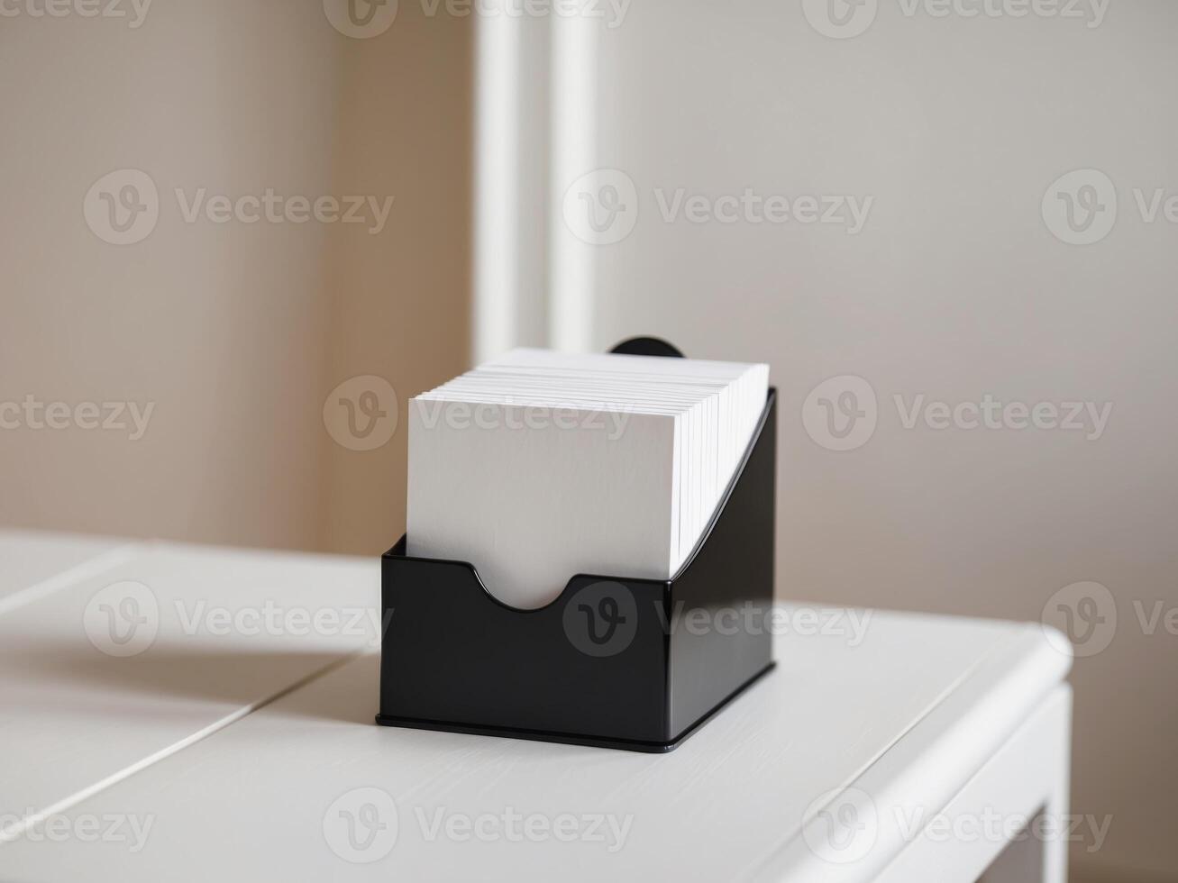 Organized blank cards in a black holder on a table. photo