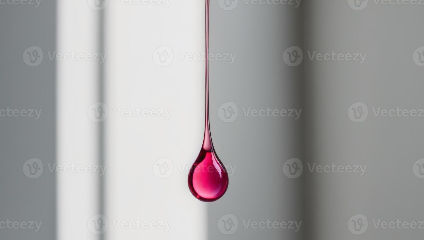 Elegance in simplicity A single drop of pink liquid. photo