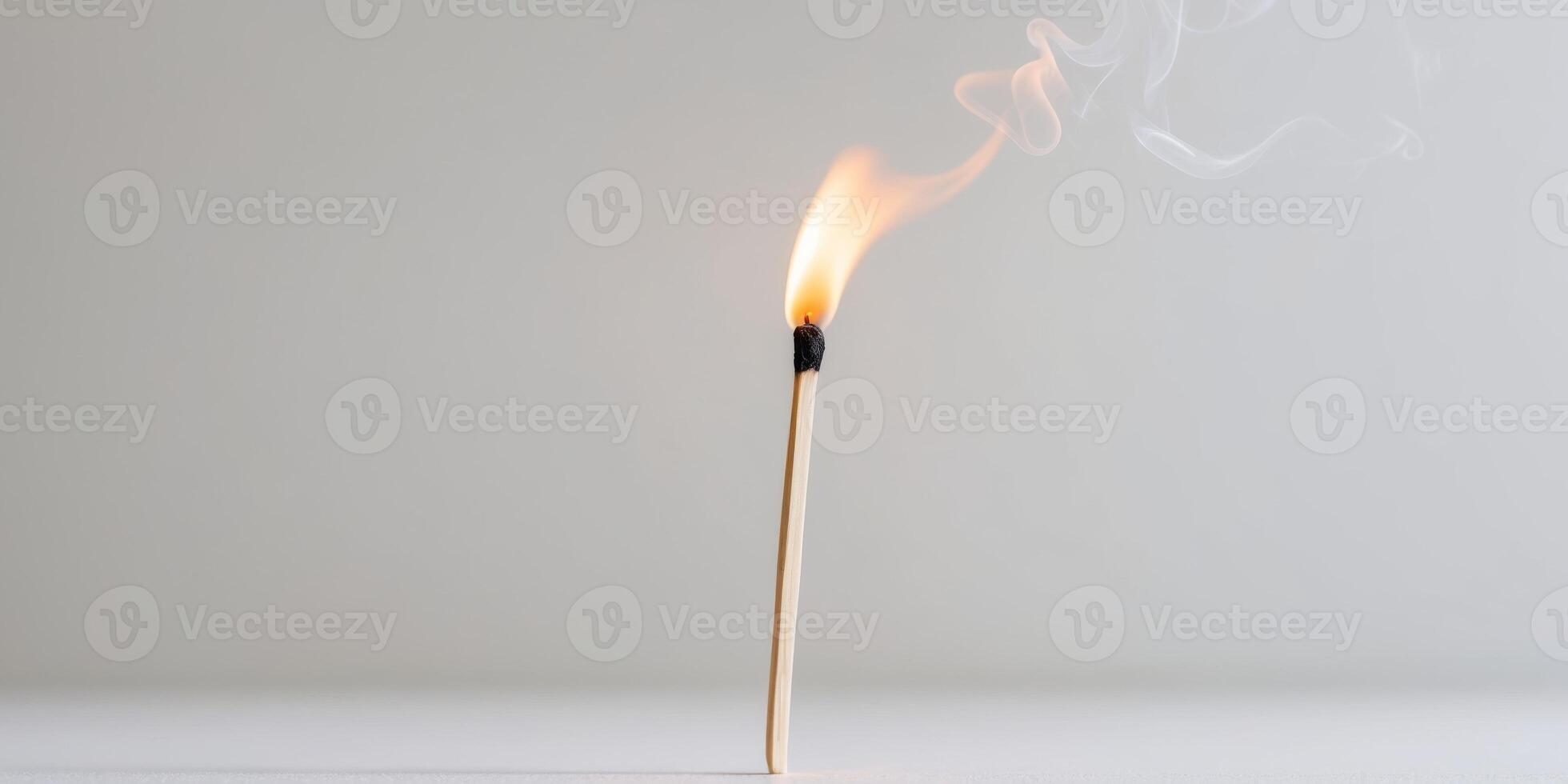 Matchstick is lit and the flame is burning. photo