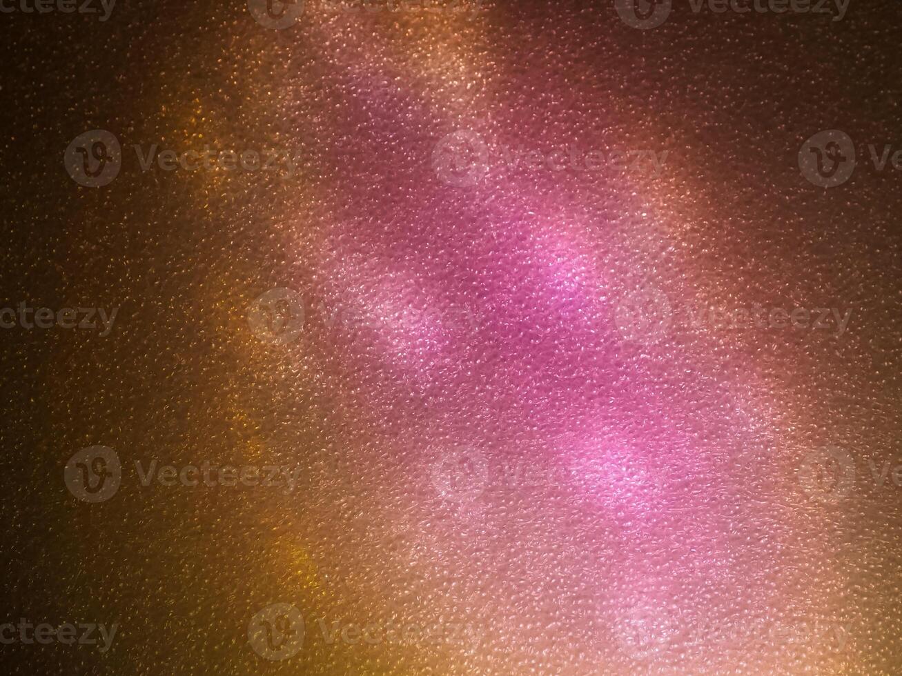 Pink reflection on foam sheet at night in the dark for abstract mysterious background. photo