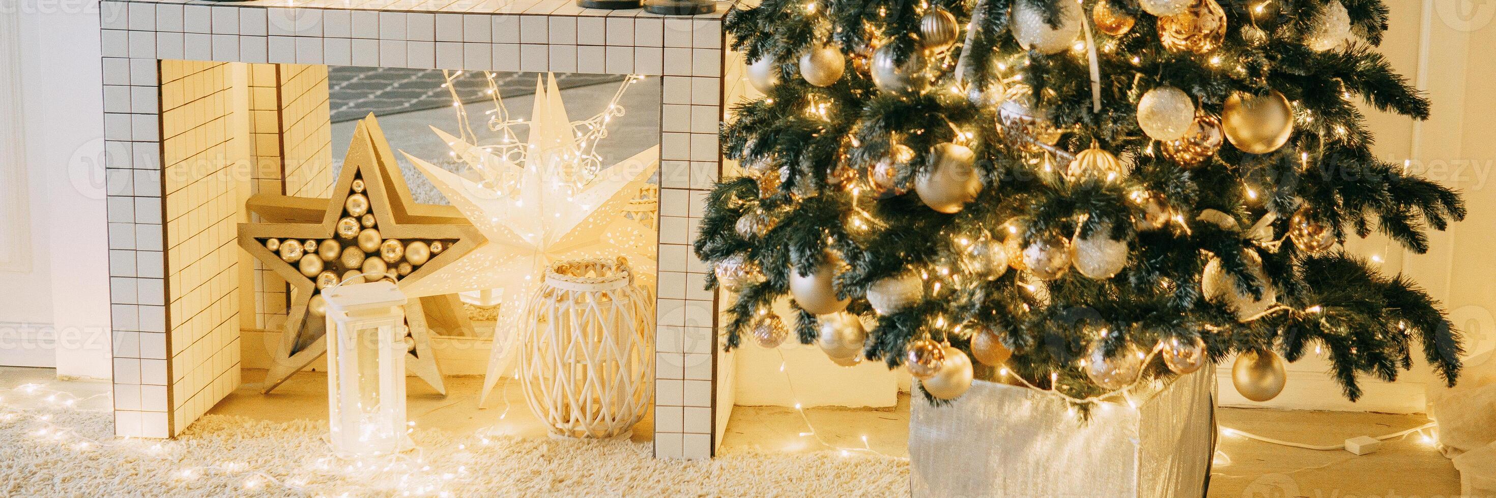 Christmas interior in a luxurious golden style with garlands in the form of stars. Background for New Year wallpapers and postcards. photo