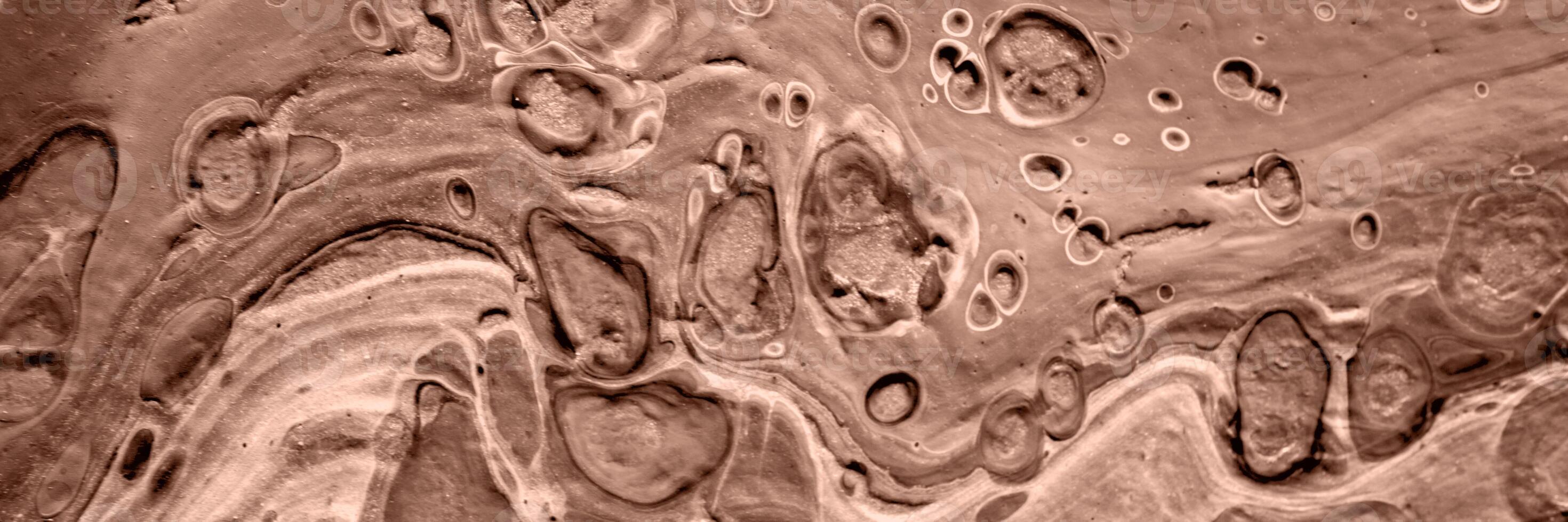 The texture of marble. Abstract background, made in the technique of fluid art. Demonstrating the colors of 2025 - Mocha Mousse photo