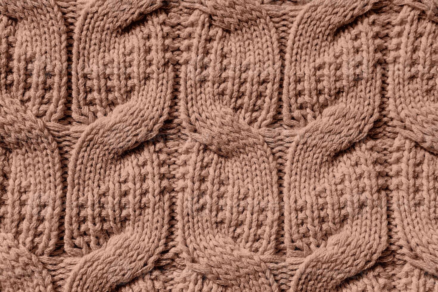 Beautiful handmade knitted repeating pattern. Demonstrating the colors of 2025 - Mocha Mousse photo