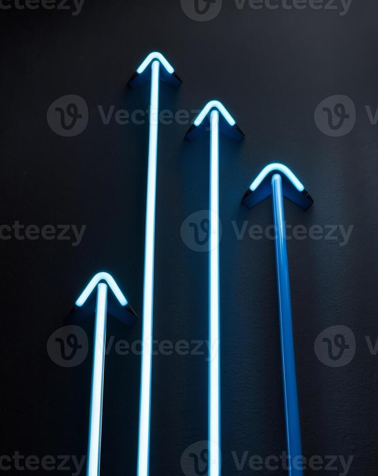 Four neon arrows are lit up in blue photo