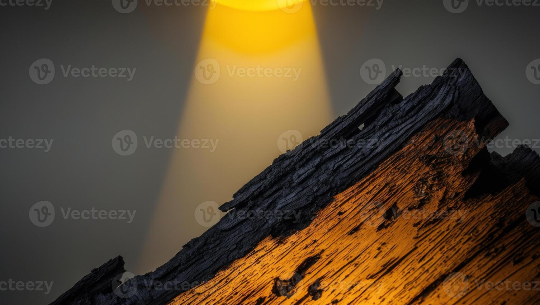 A yellow light shines through the dark sky photo