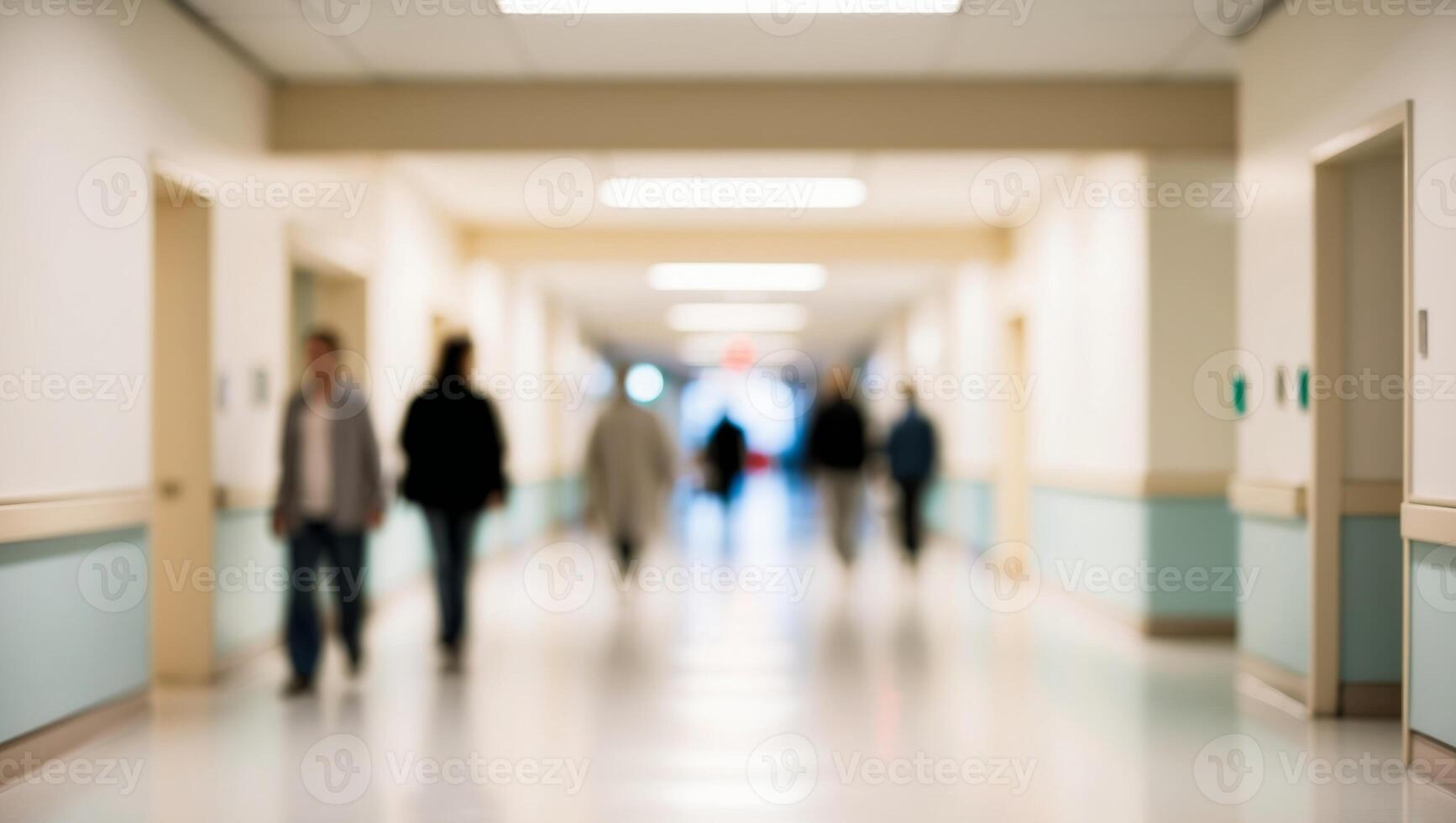 A blurry image of people walking down a hallway photo