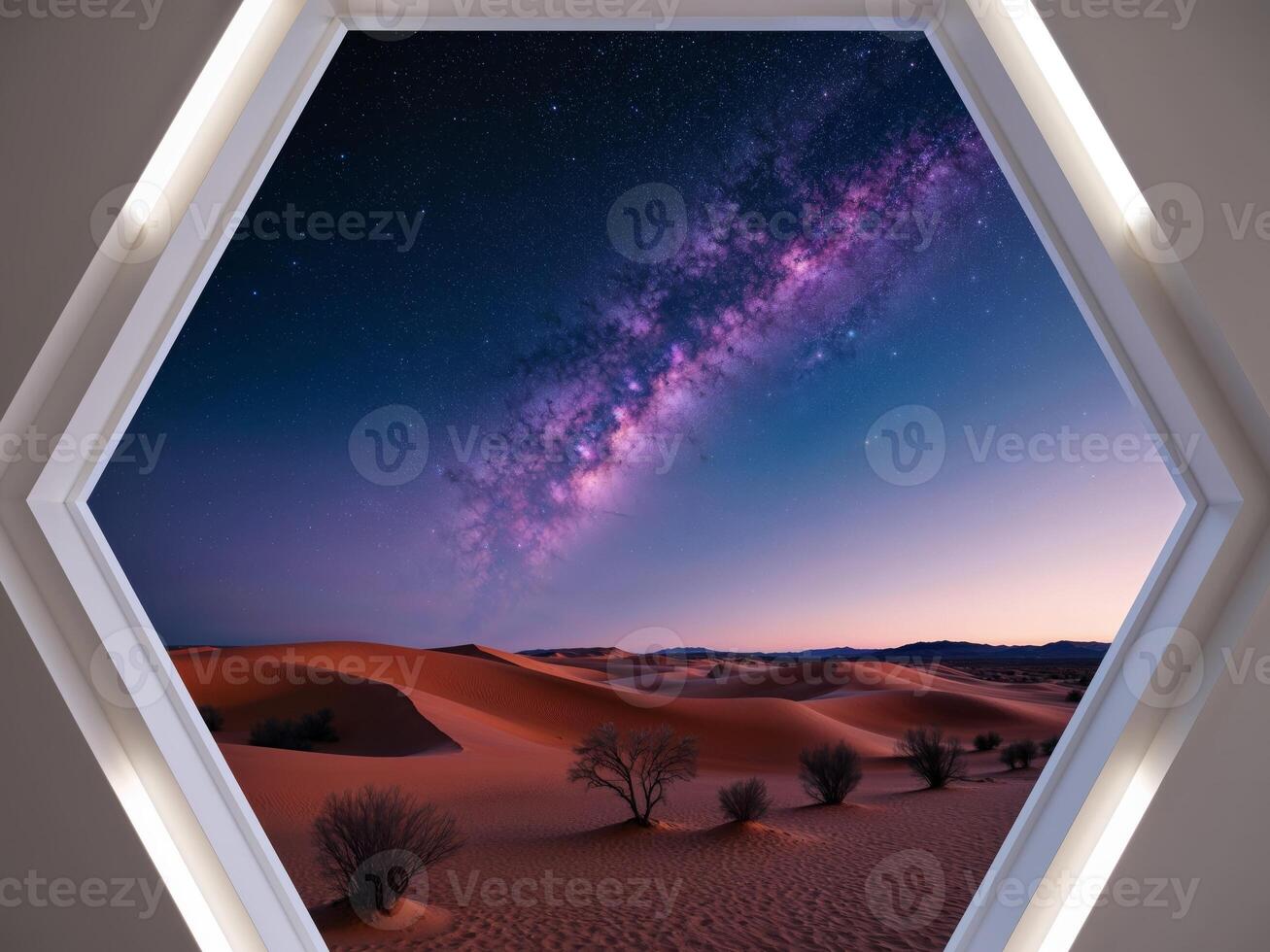 A hexagon shaped window with a view of the desert photo