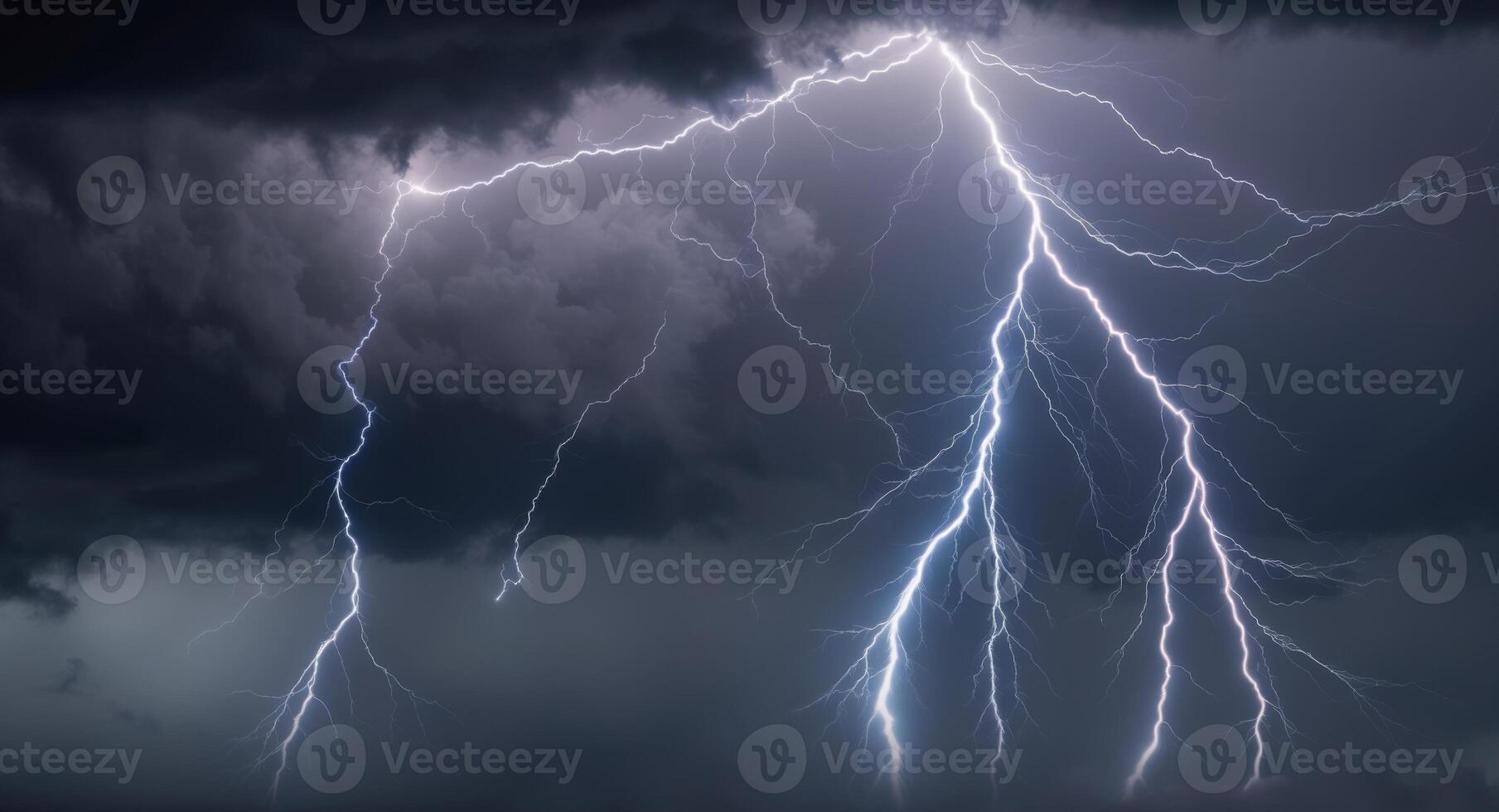 Lightning strikes over a dark sky with clouds photo
