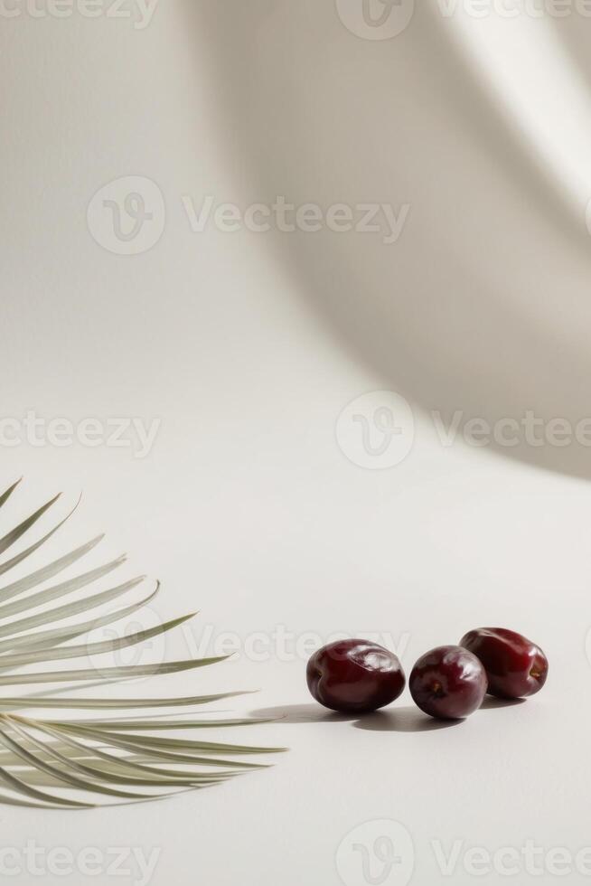 Date palm and two dates on white background photo