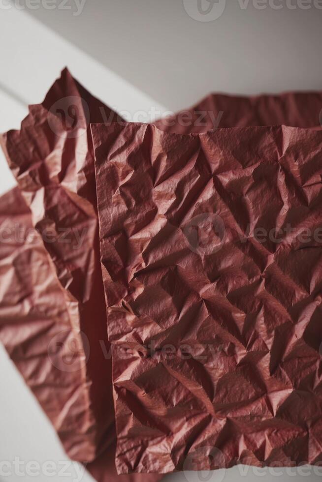 A piece of red paper folded into a triangle photo