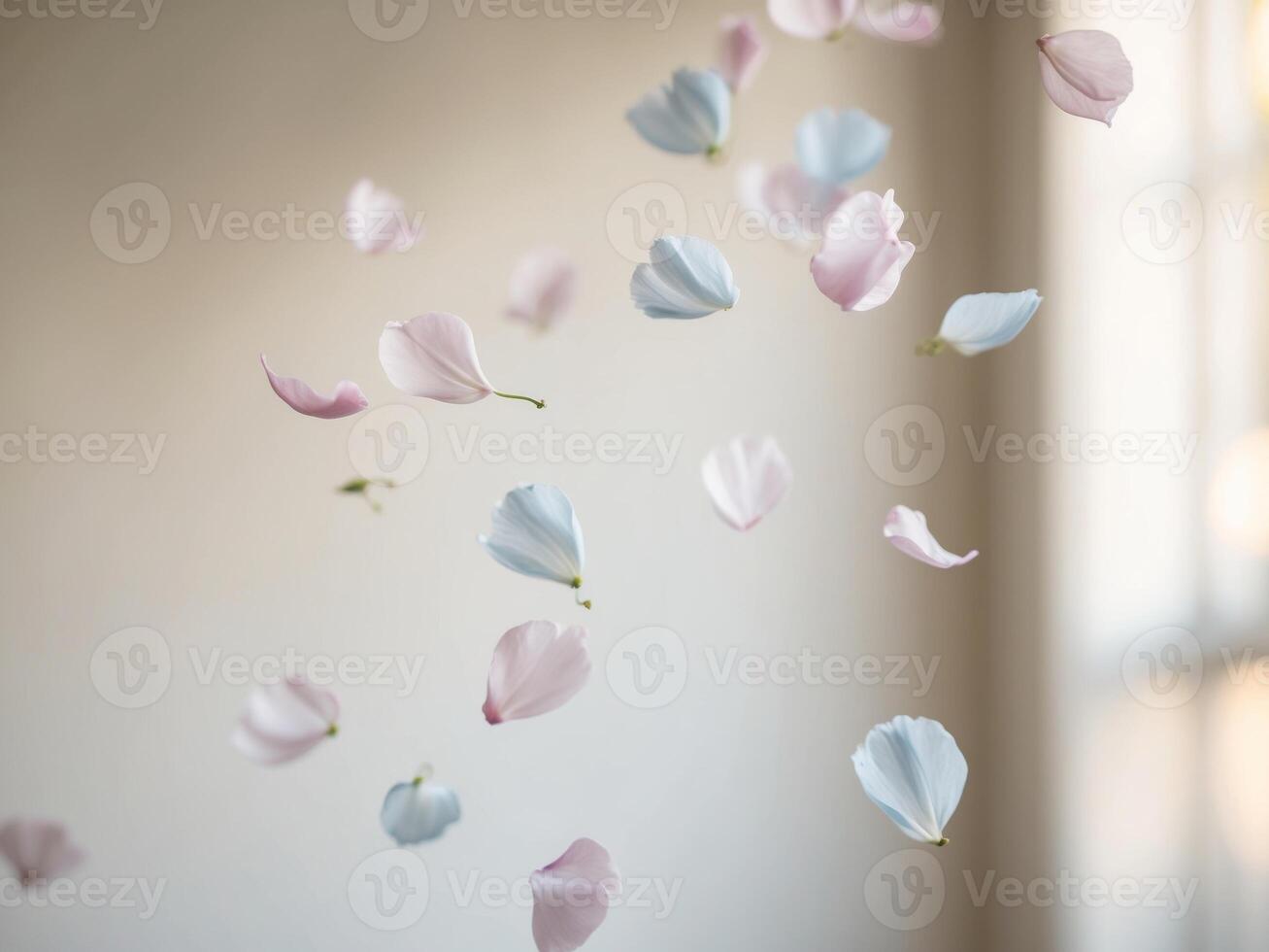 A bunch of pink and blue flowers are flying in the air photo