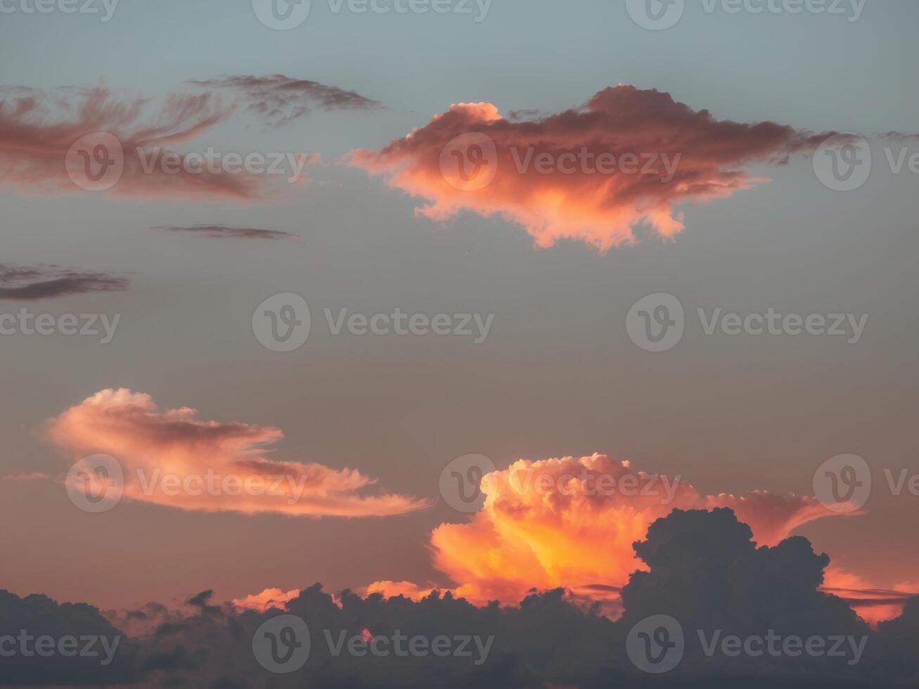 A sunset with clouds in the sky photo