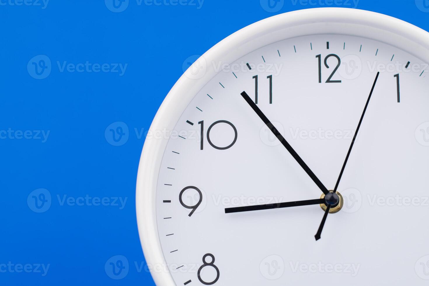 Clock telling time and working on time photo in studio on blue background