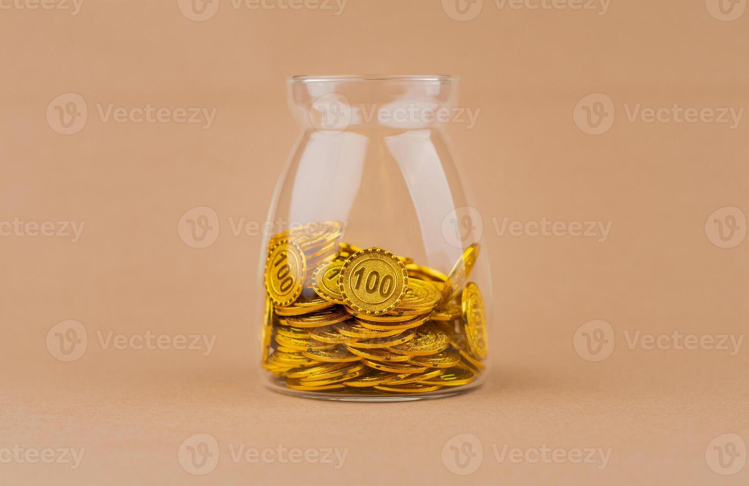 Saving gold in a glass bottle creates financial security and wealth. Income from investment, gold coins. photo