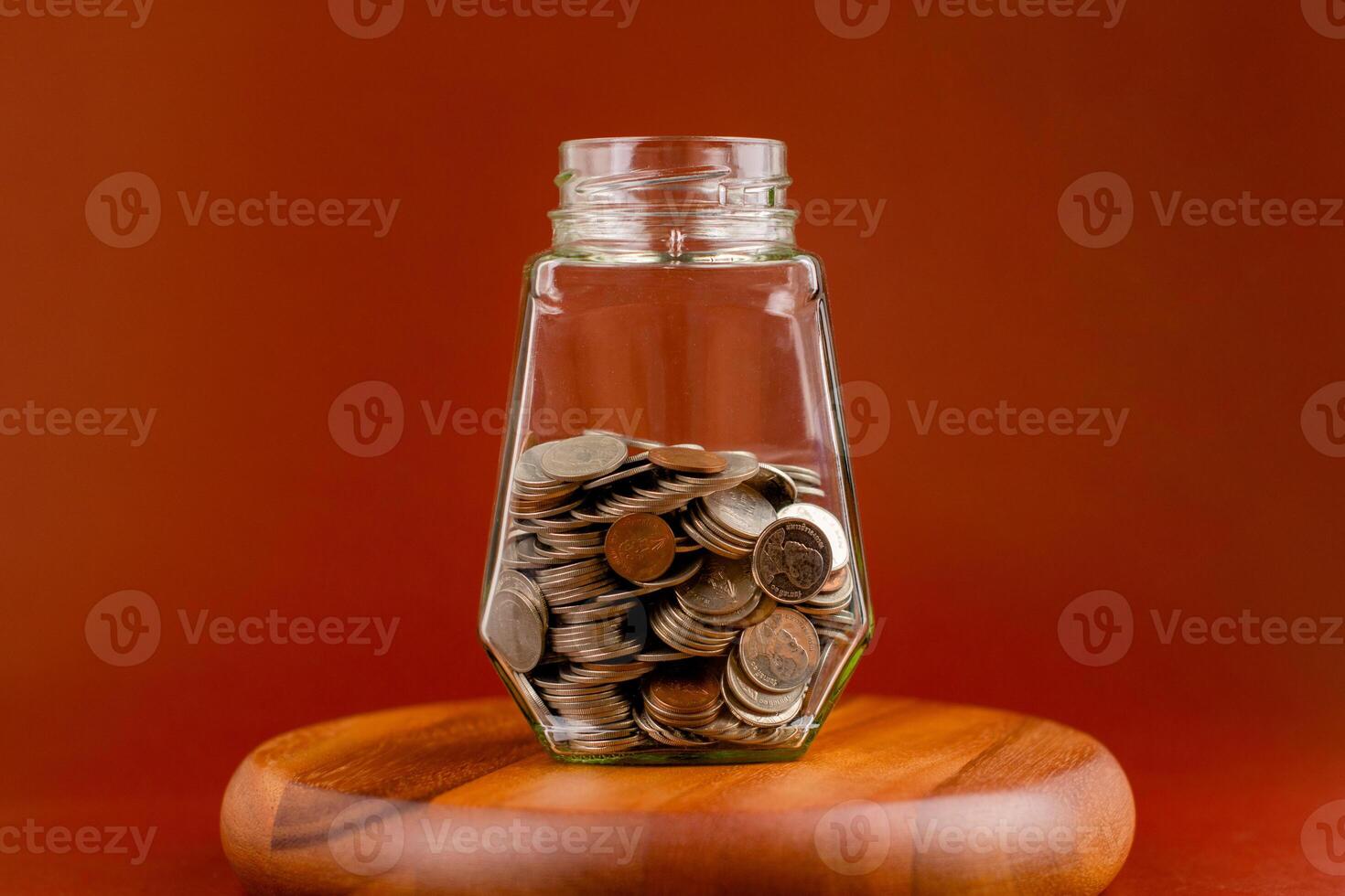 Saving coins in a piggy bank creates financial security, income from work and investment, cash flow. photo