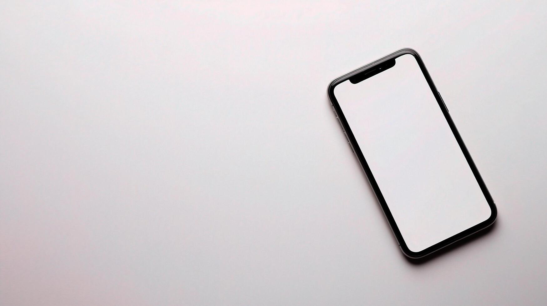 An iphone is shown on a white surface photo