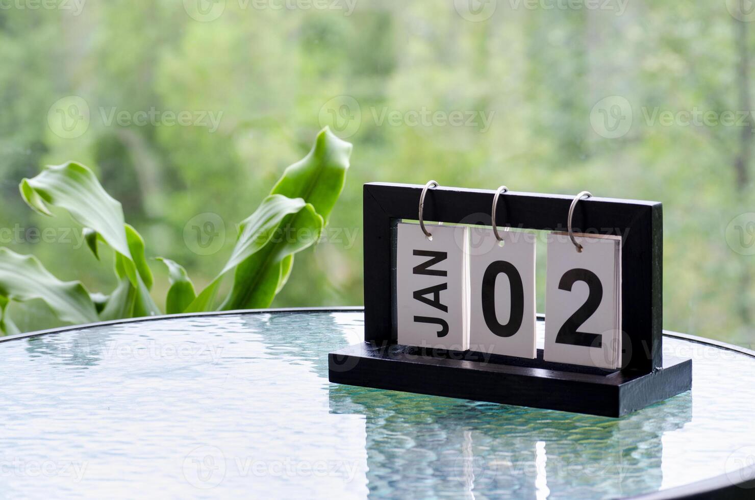 2 January calendar table with blurred nature background. With customizable space for text or ideas photo