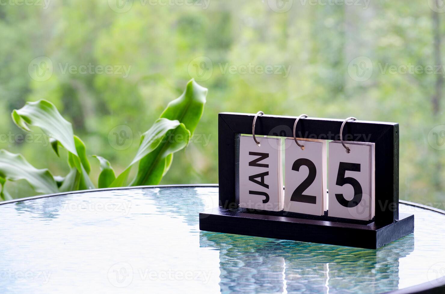 25 January calendar table with blurred nature background. With customizable space for text or ideas photo
