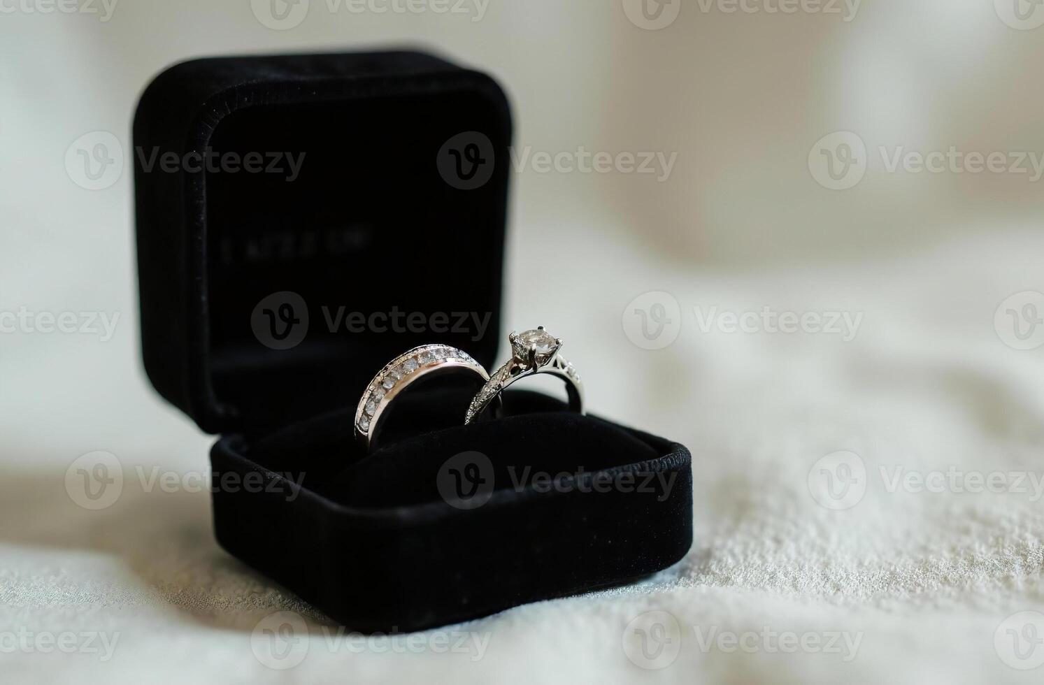 Diamond Engagement Rings Black Velvet Box on light Background photo