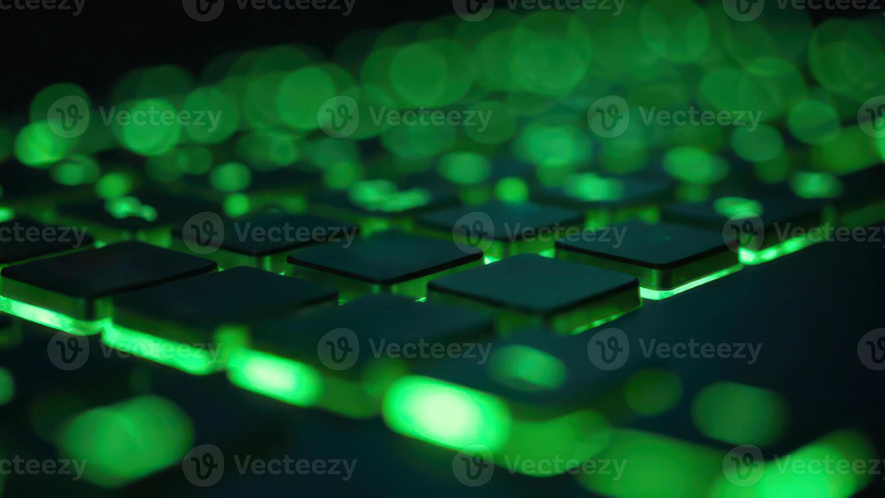 Close-up of green led-illuminated keyboard with blurred bokeh effect photo