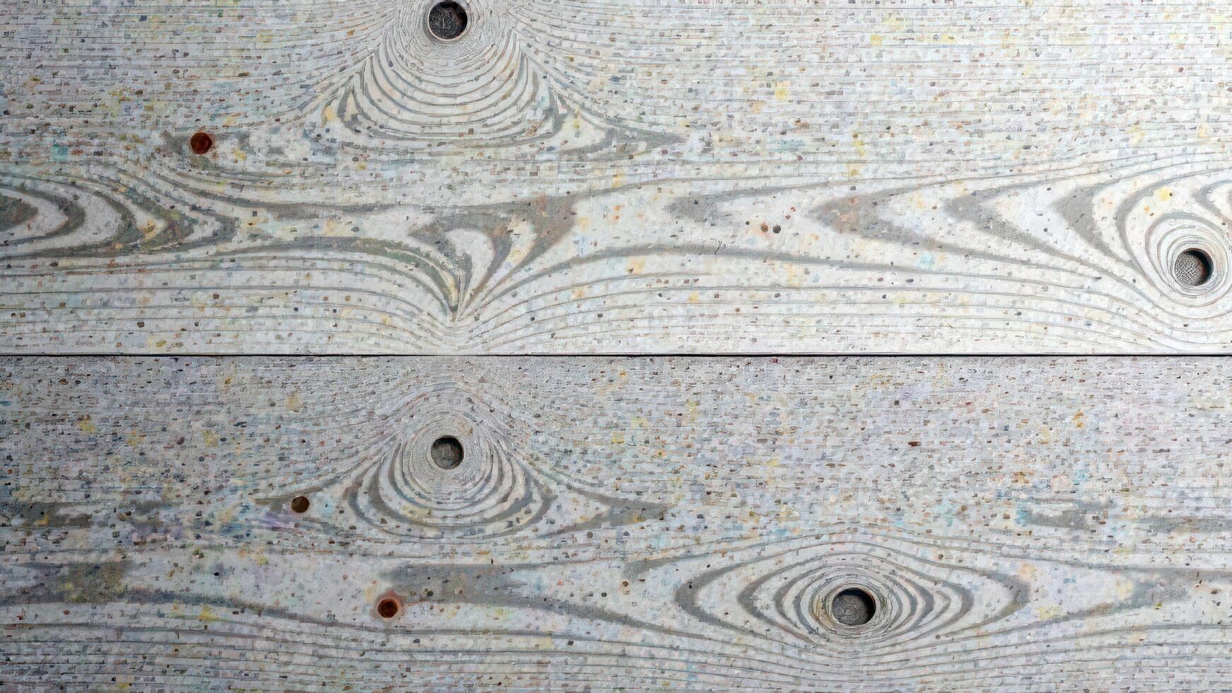 Textured wooden surface with distinctive grain patterns and knots photo