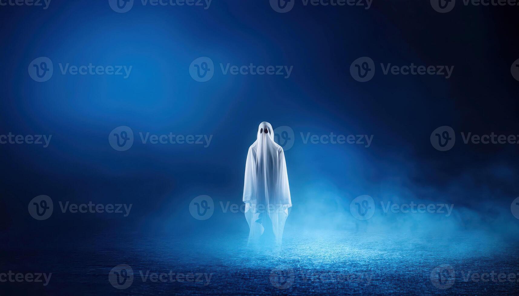 Ghostly figure in misty blue atmosphere at night photo