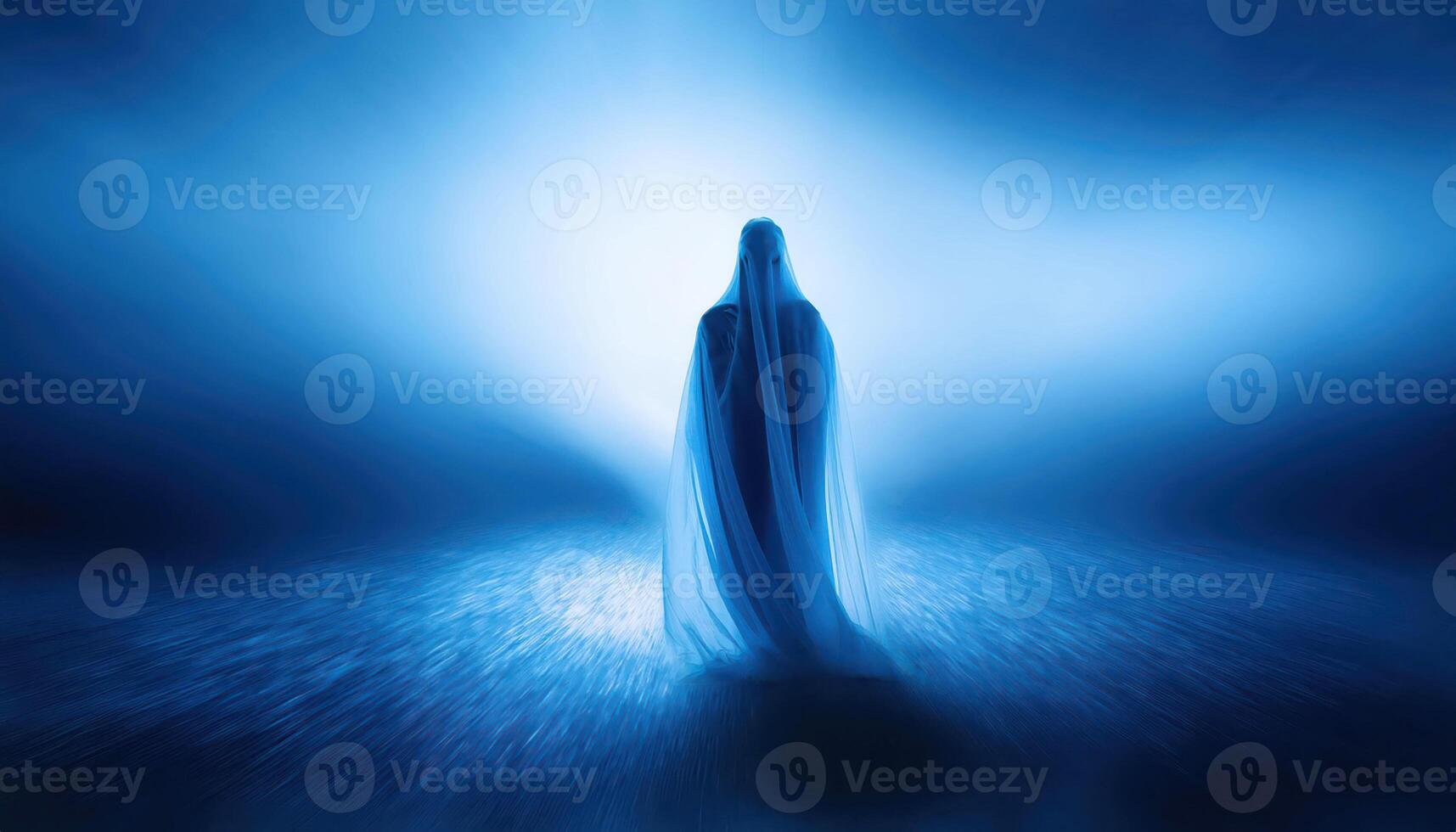 Ethereal figure in blue misty light with mysterious aura photo