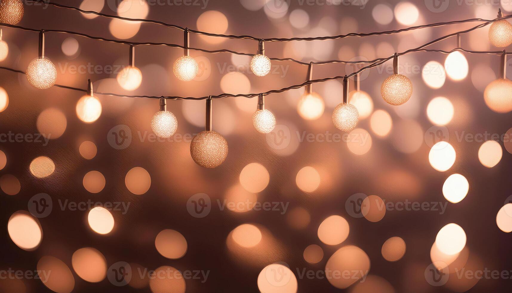 Warm glowing string lights with abstract bokeh background photo
