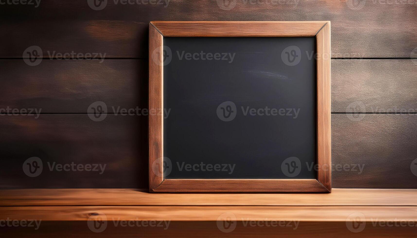 Empty chalkboard with wooden frame on rustic wooden background photo