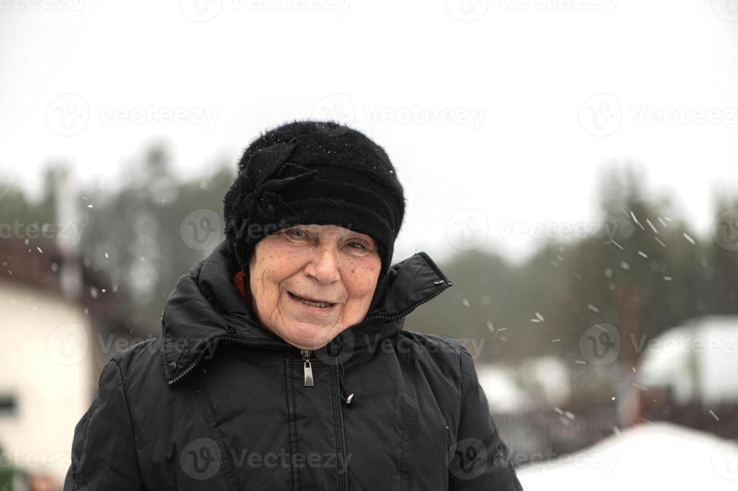 Close-up portrait of elderly senior woman face photo