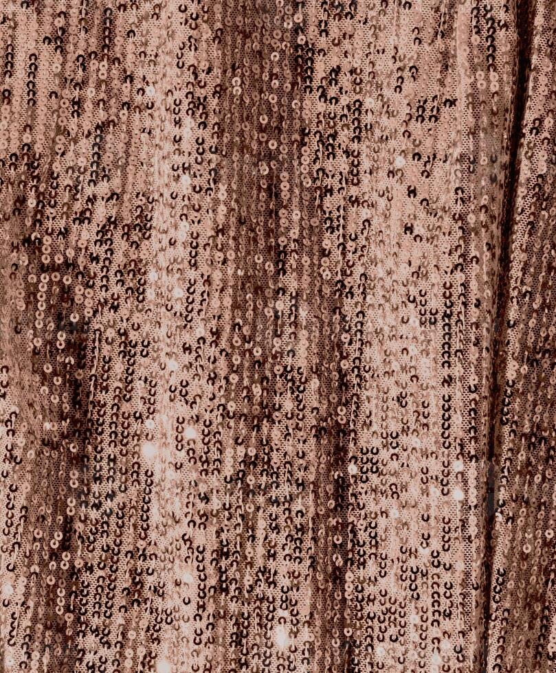 Shimmering rose gold sequin fabric with elegant sparkle and texture photo
