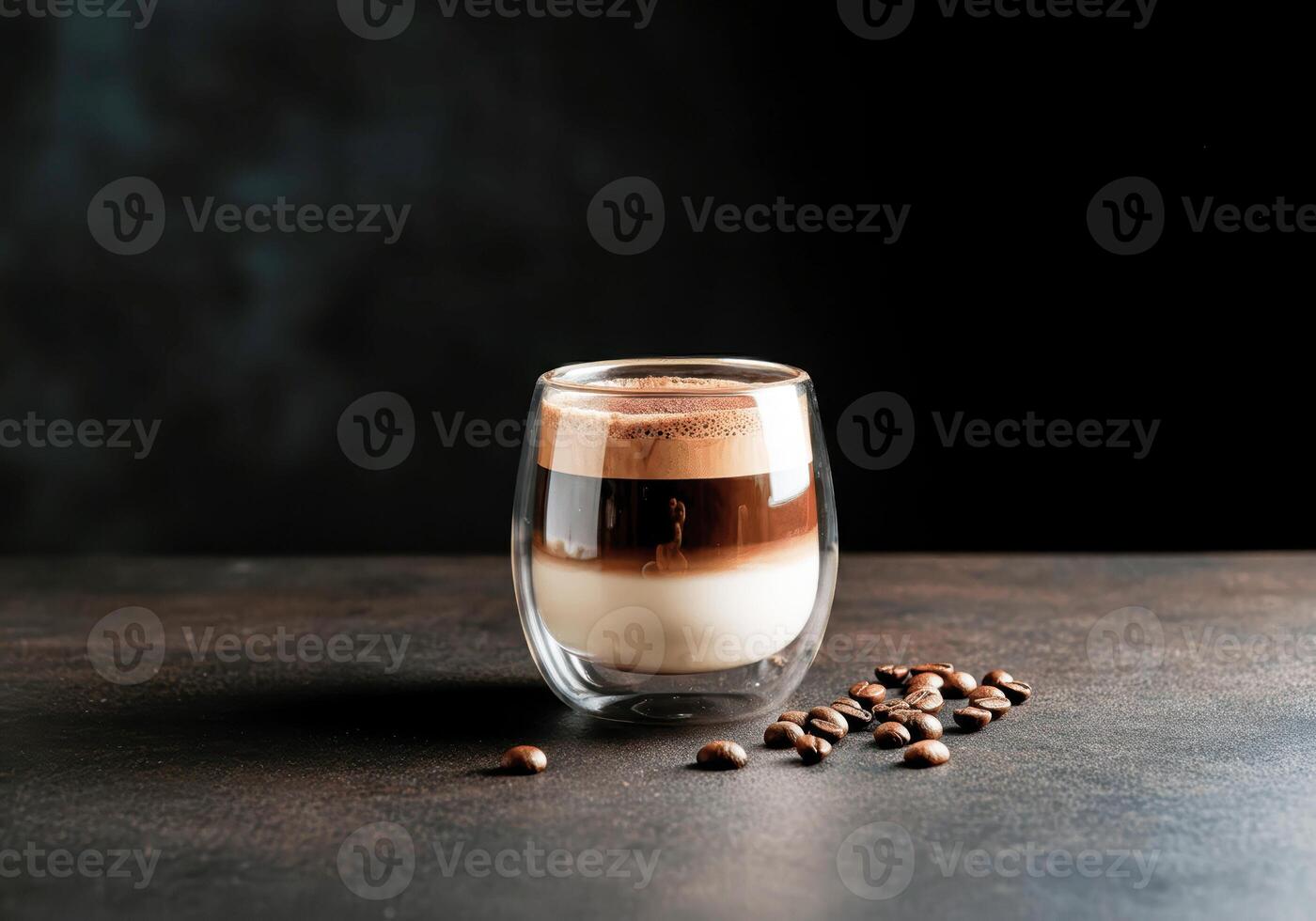 Layered mocha coffee in glass with coffee beans on dark background photo