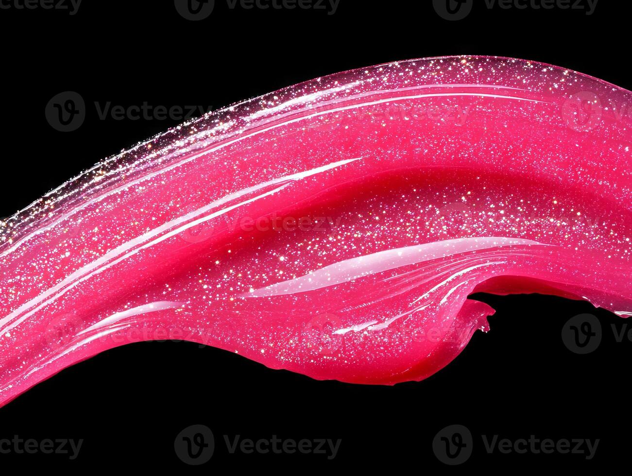 A close up of a pink liquid lipstick on a black background photo