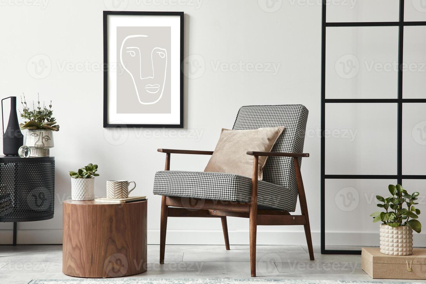 Stylish scandinavian composition of living room with design armchair, black mock up poster frame, commode, wooden stool, book, decoration, loft wall and personal accessories in modern home decor. photo