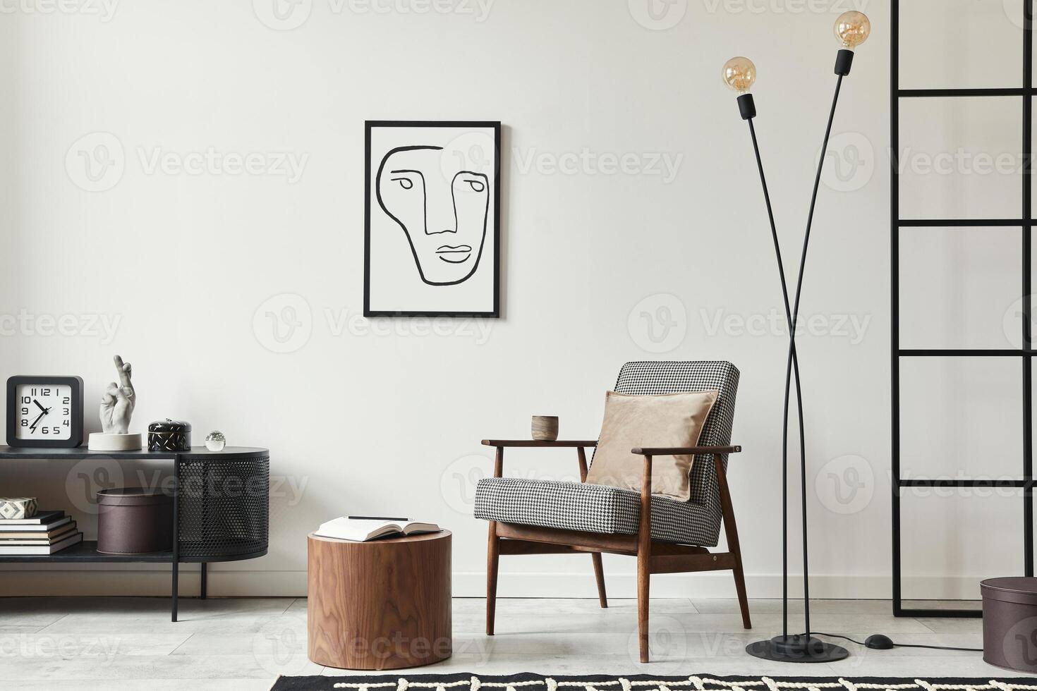 Stylish scandinavian composition of living room with design armchair, black mock up poster frame, commode, wooden stool, lamp, decoration, loft wall and personal accessories in modern home decor. photo