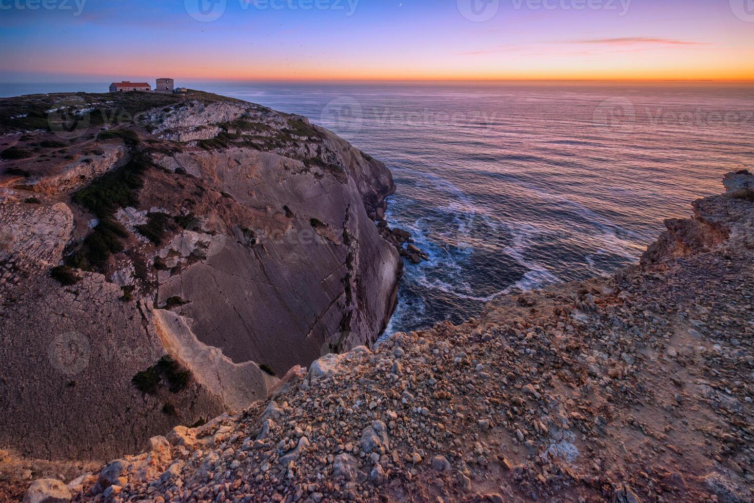 Cabo Espichel cape Espichel on Atlantic ocean at sunset photo