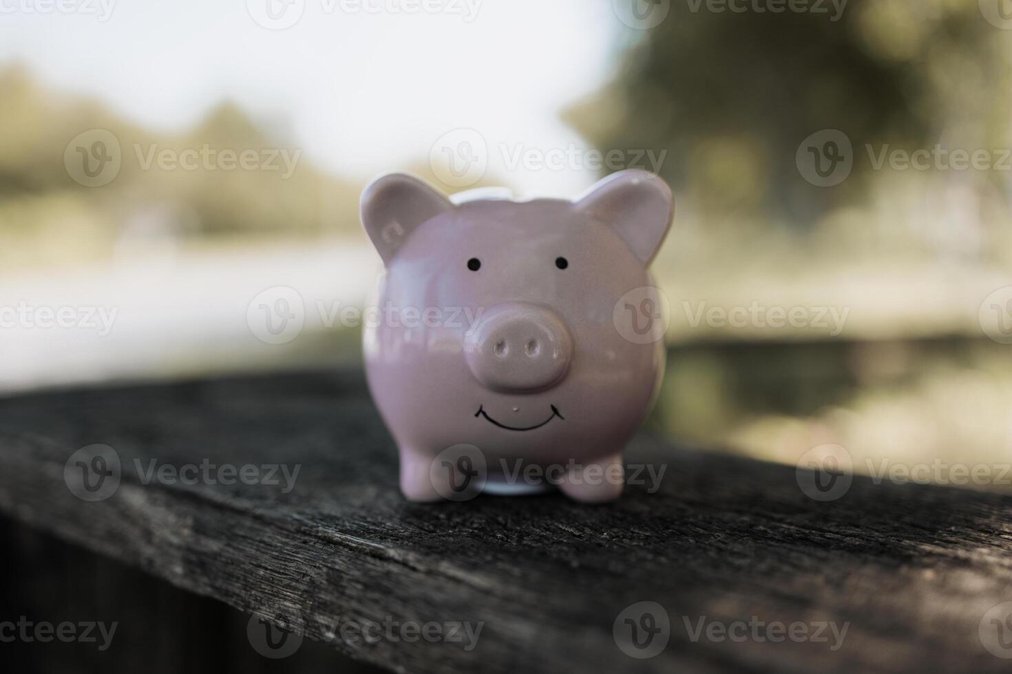 A pin piggy bank on the table. saving money, investment, currency concept photo
