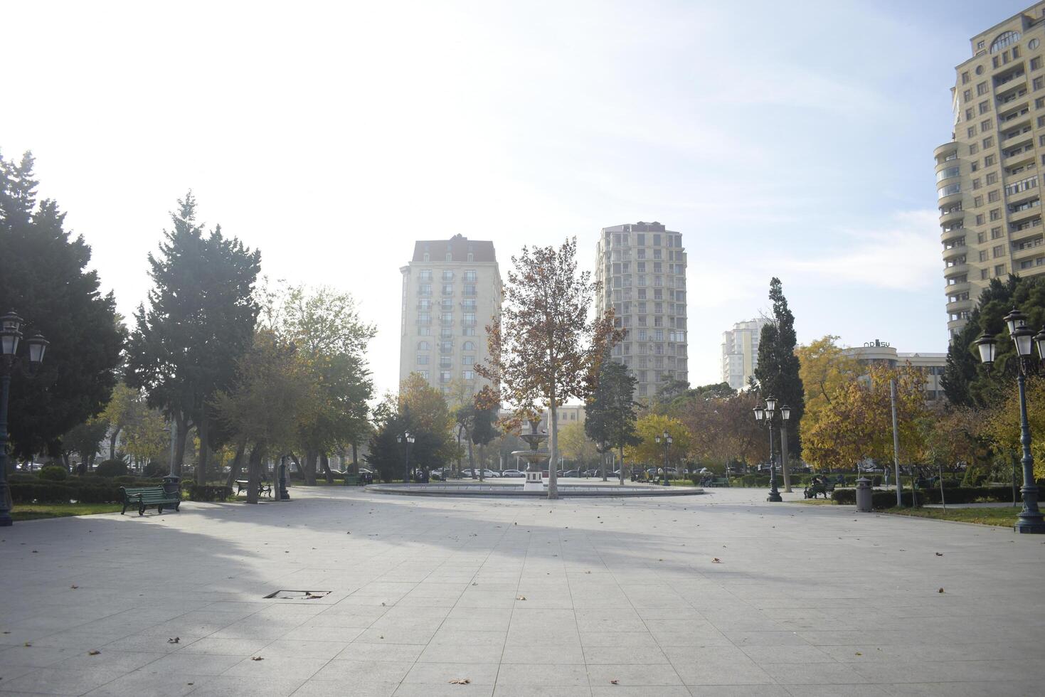 City Square with Autumn Trees and Buildings photo