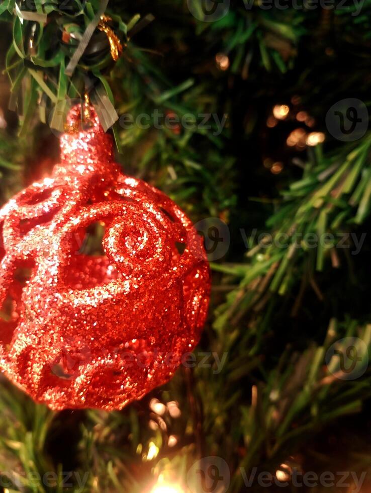 abstract twinkling christmas ornament decorated tree wallpaper background in red sparkle glitter colored photo