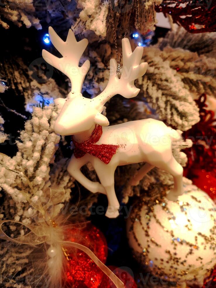 abstract christmas deer ornament decorated tree wallpaper background in white colored photo