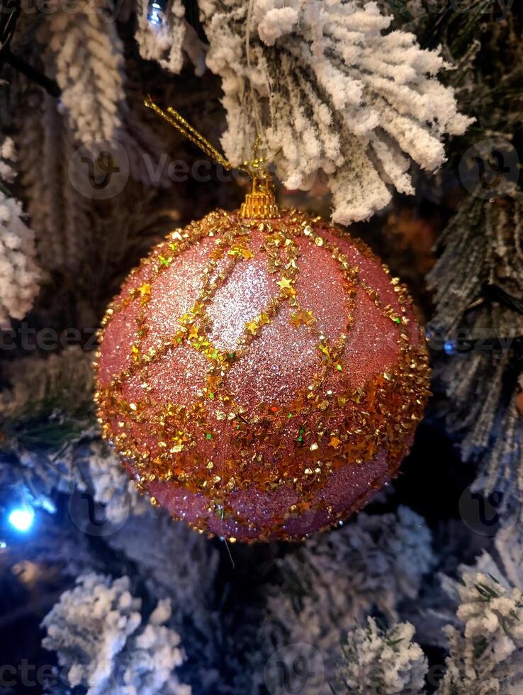 abstract twinkling christmas ornament decorated tree wallpaper background in red sparkle glitter colored photo