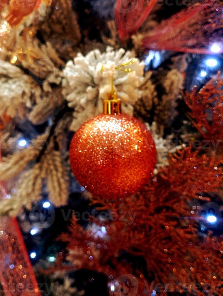 abstract twinkling christmas ornament decorated tree wallpaper background in red sparkle glitter colored photo