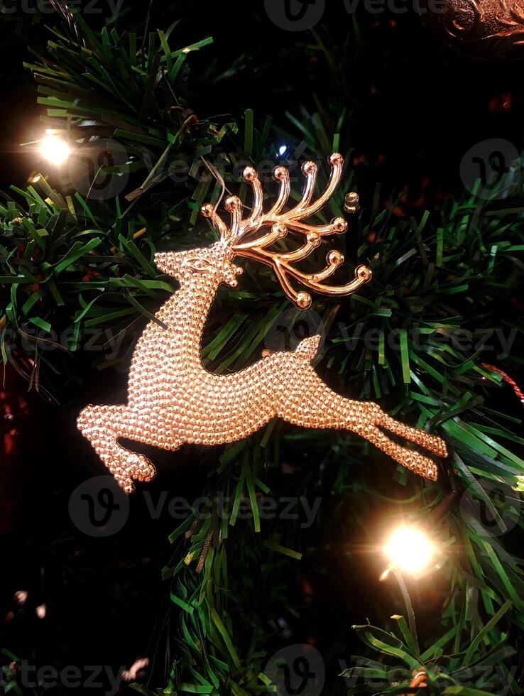 abstract christmas deer ornament decorated tree wallpaper background in white colored photo