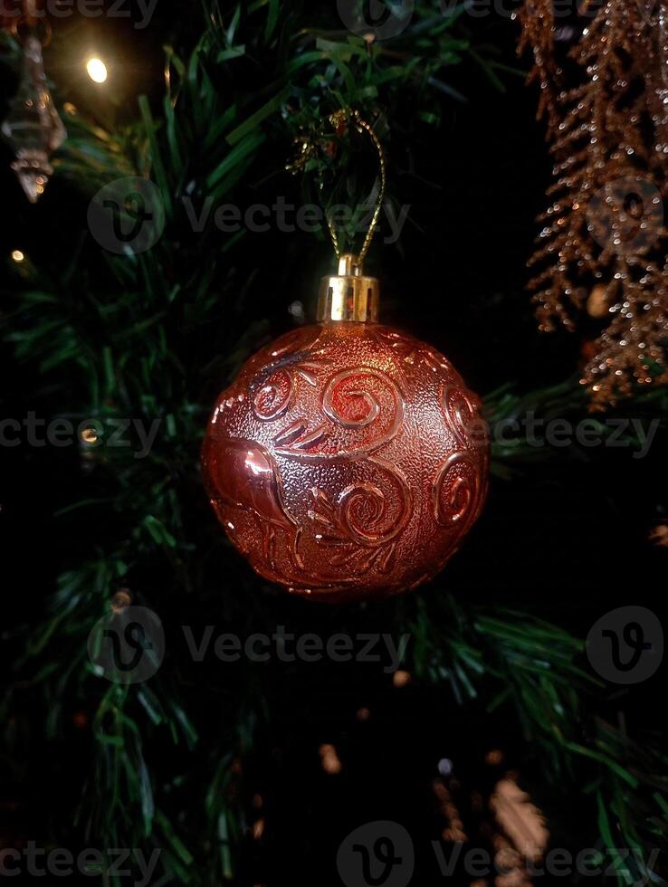 abstract twinkling christmas ornament decorated tree wallpaper background in red sparkle glitter colored photo