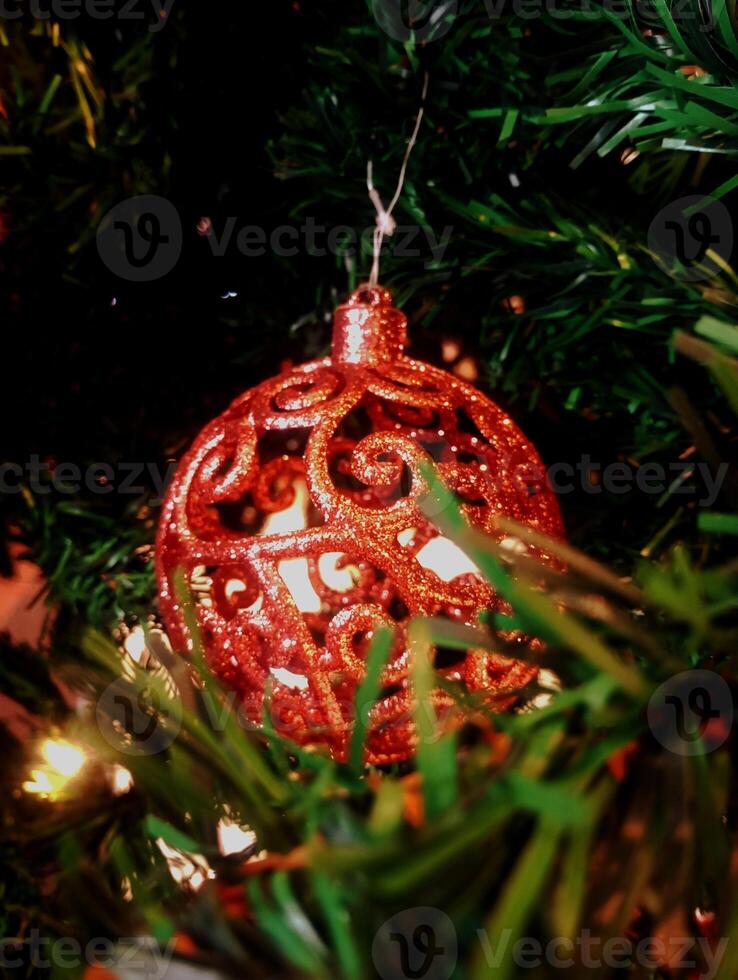 abstract twinkling christmas ornament decorated tree wallpaper background in red sparkle glitter colored photo