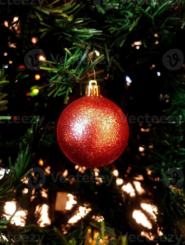 abstract twinkling christmas ornament decorated tree wallpaper background in red sparkle glitter colored photo