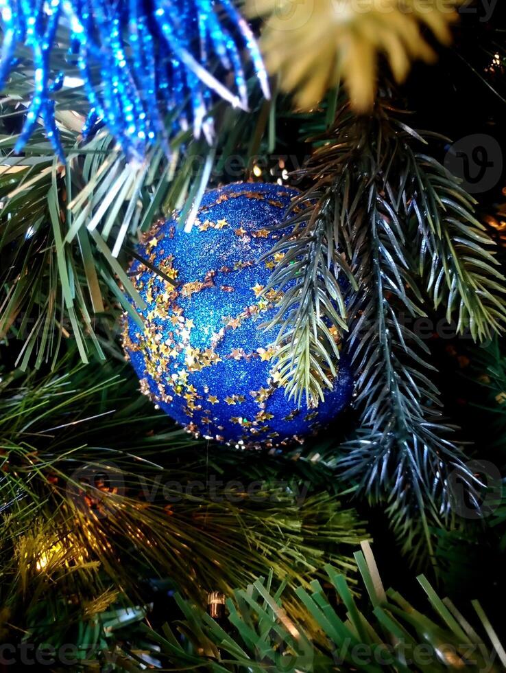 abstract twinkling christmas decorated tree wallpaper background in blue sparkle glitter colored photo