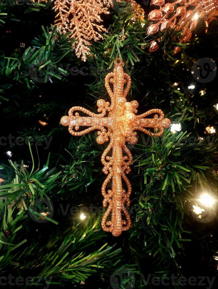 abstract christmas cross ornament decorated tree wallpaper background in gold sparkle colored photo
