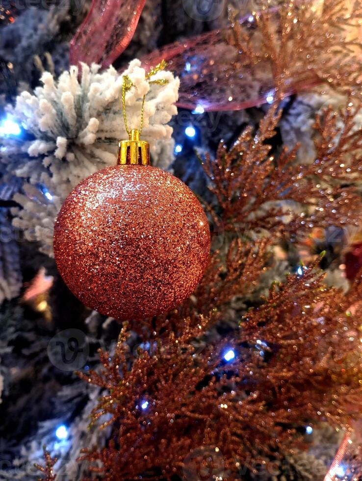 abstract twinkling christmas ornament decorated tree wallpaper background in red sparkle glitter colored photo