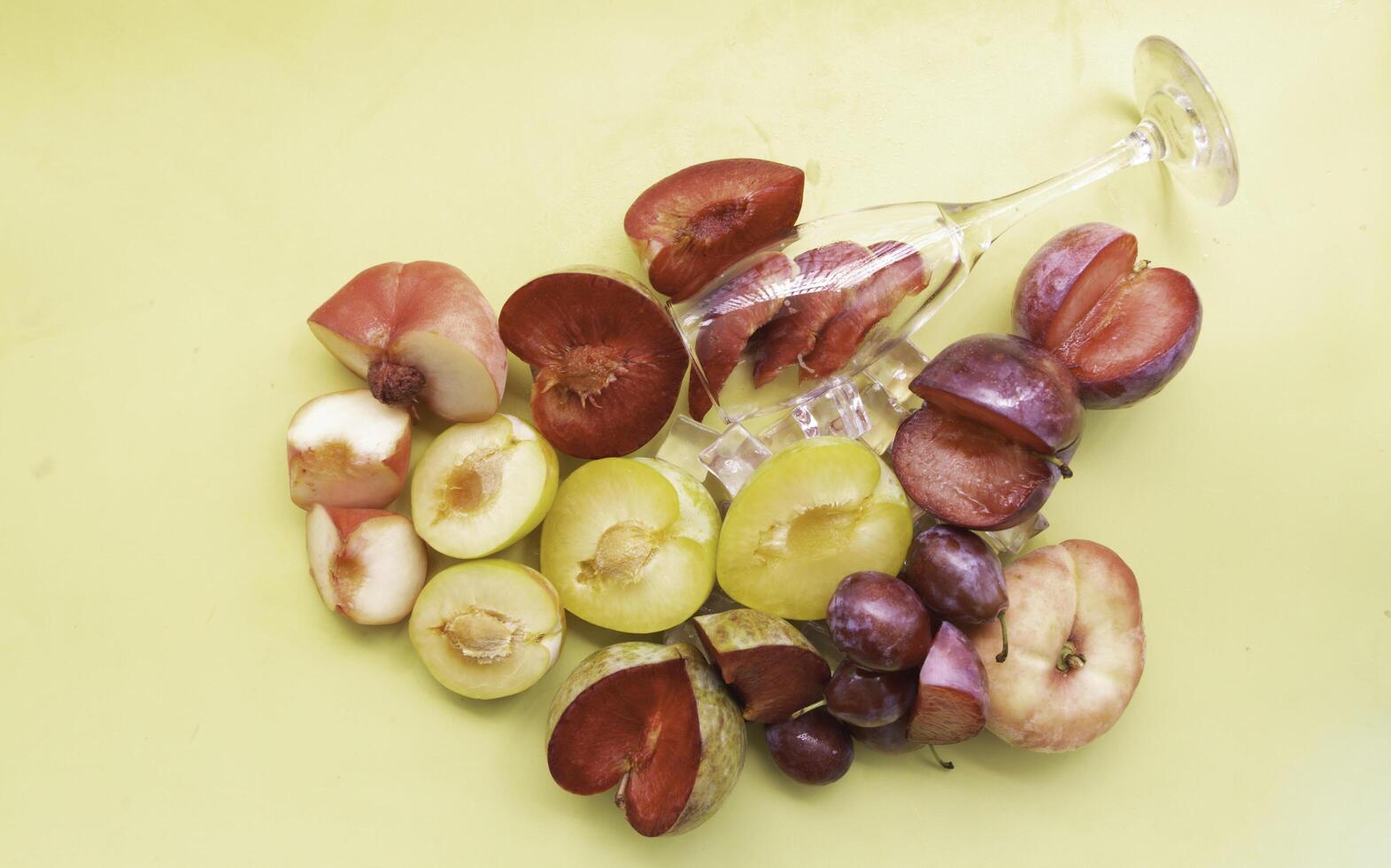 Cutted of Plum and Peach put on pastel background photo